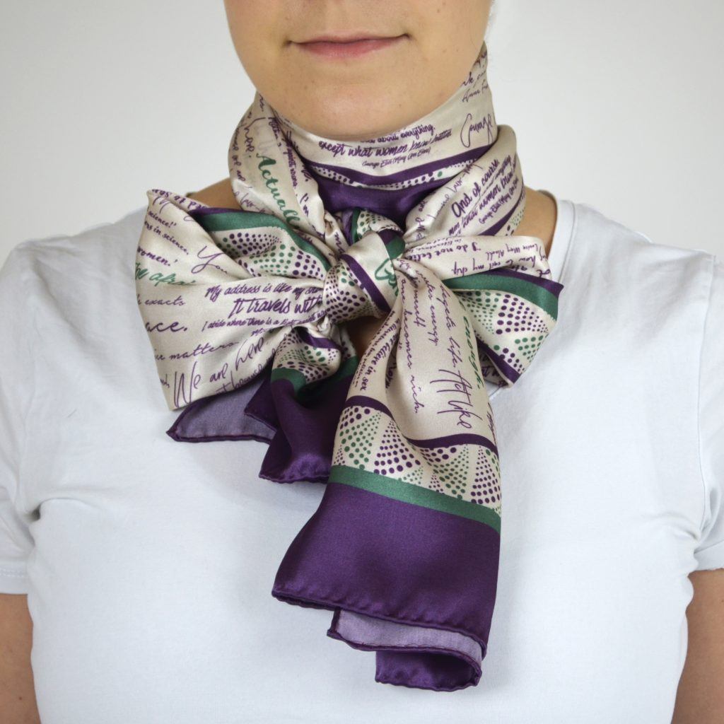 Silk scarf tied in large bow around neck
