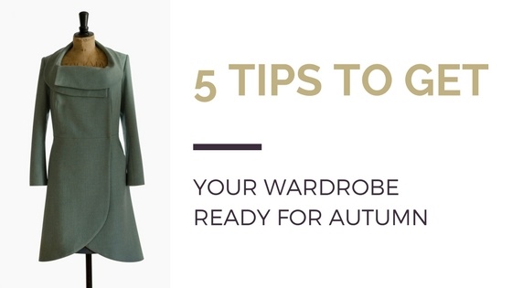 Blog title next to image of pale turquoise coat on tailor's mannequin