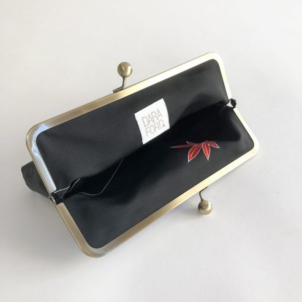 Silk Lining of a Black clutch bag with Art Deco style fan design