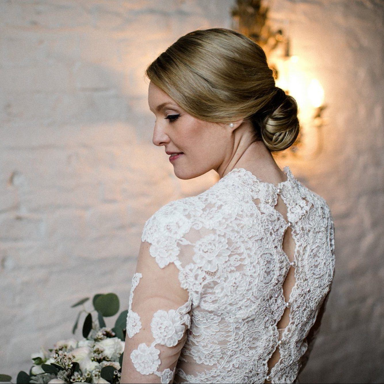 Back view of bride wearing a custom lace wedding dress