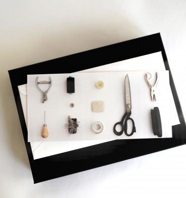 Birdseyeview of Dara Ford gift voucher depicting tailoring tools