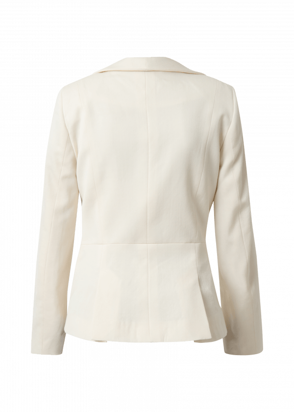 Image shows the back of a cream fitted blazer with seams