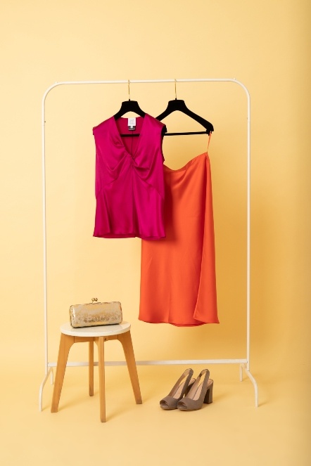 Smart summer outfit for women Pink silk camisole and orange skirt with shoes and gold clutch bag