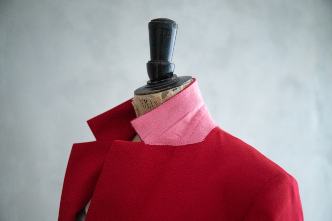 Close up of womens tailored jacket with the collar turned up