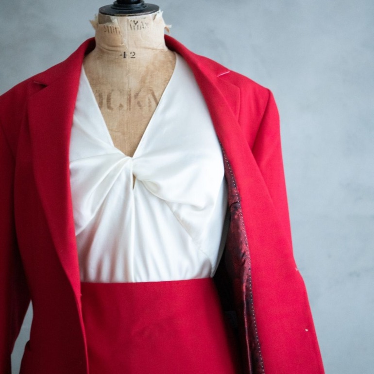 Red tailored blazer with silk lining and silk cream camisole on dressmakers dummy
